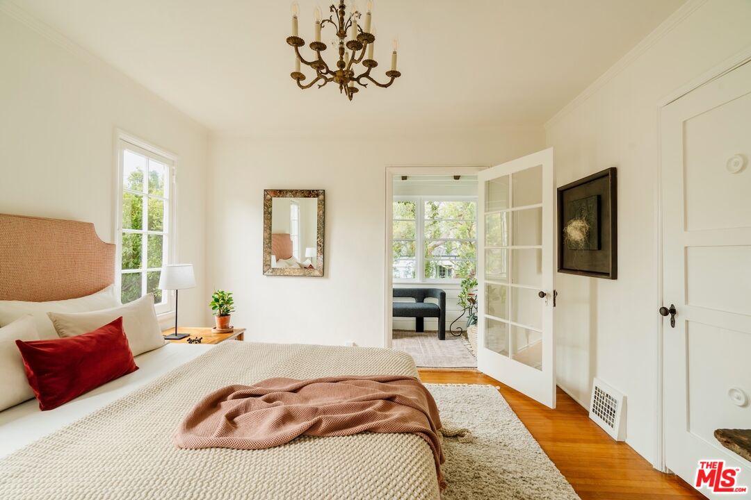 3325 Lowry Road Los Angeles, CA 90027 - Photo 48 of 73 a bedroom with a bed and a flat screen tv