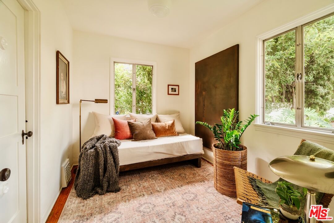 3325 Lowry Road Los Angeles, CA 90027 - Photo 53 of 73 a bedroom with a bed and large windows