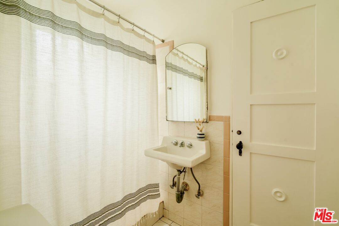 3325 Lowry Road Los Angeles, CA 90027 - Photo 55 of 73 a bathroom with a sink a toilet and shower