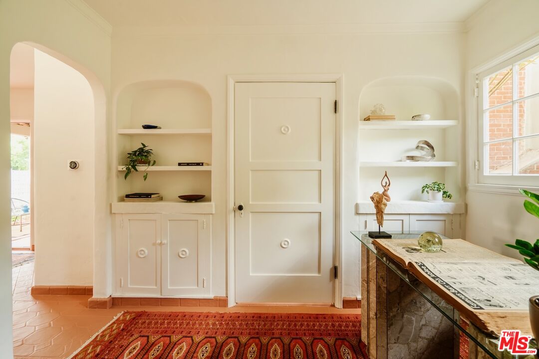 3325 Lowry Road Los Angeles, CA 90027 - Photo 58 of 73 a spacious bathroom with a granite countertop sink and a mirror