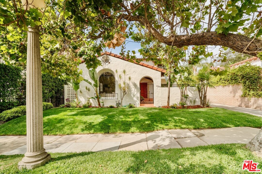 3325 Lowry Road Los Angeles, CA 90027 - Photo 71 of 73 a view of a white house with a yard