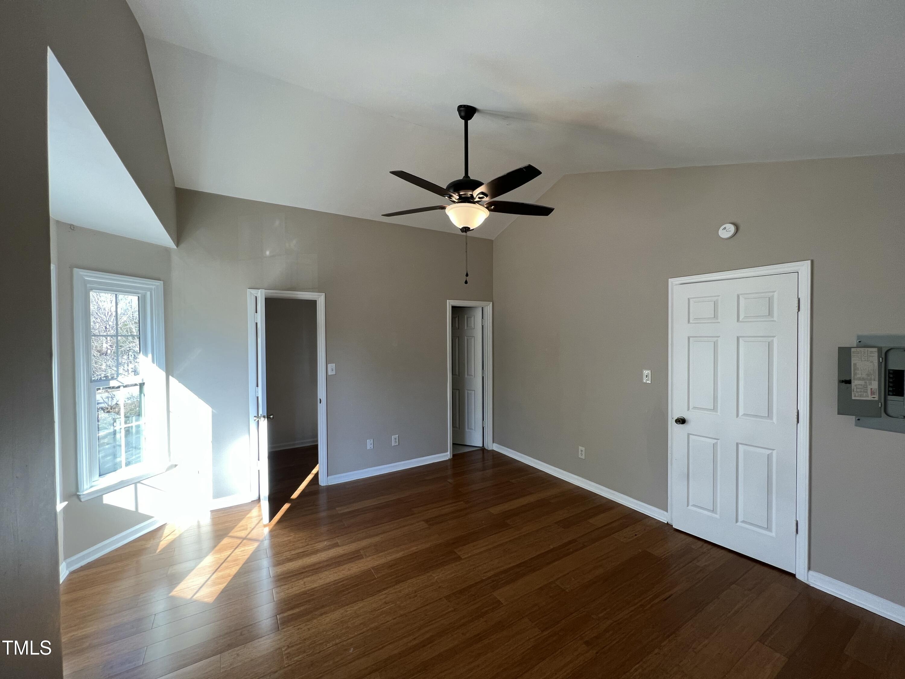 4416 Labrador Drive Raleigh, NC 27616 - Photo 13 of 19 a view of an empty room with wooden floor