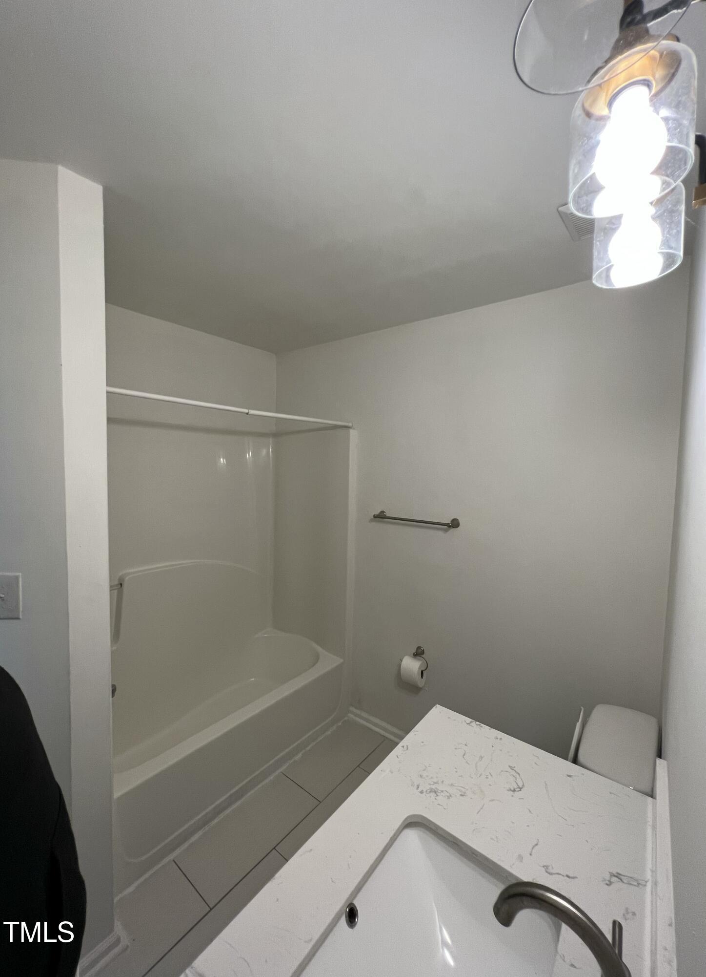 4416 Labrador Drive Raleigh, NC 27616 - Photo 18 of 19 a bathroom with a sink and a shower