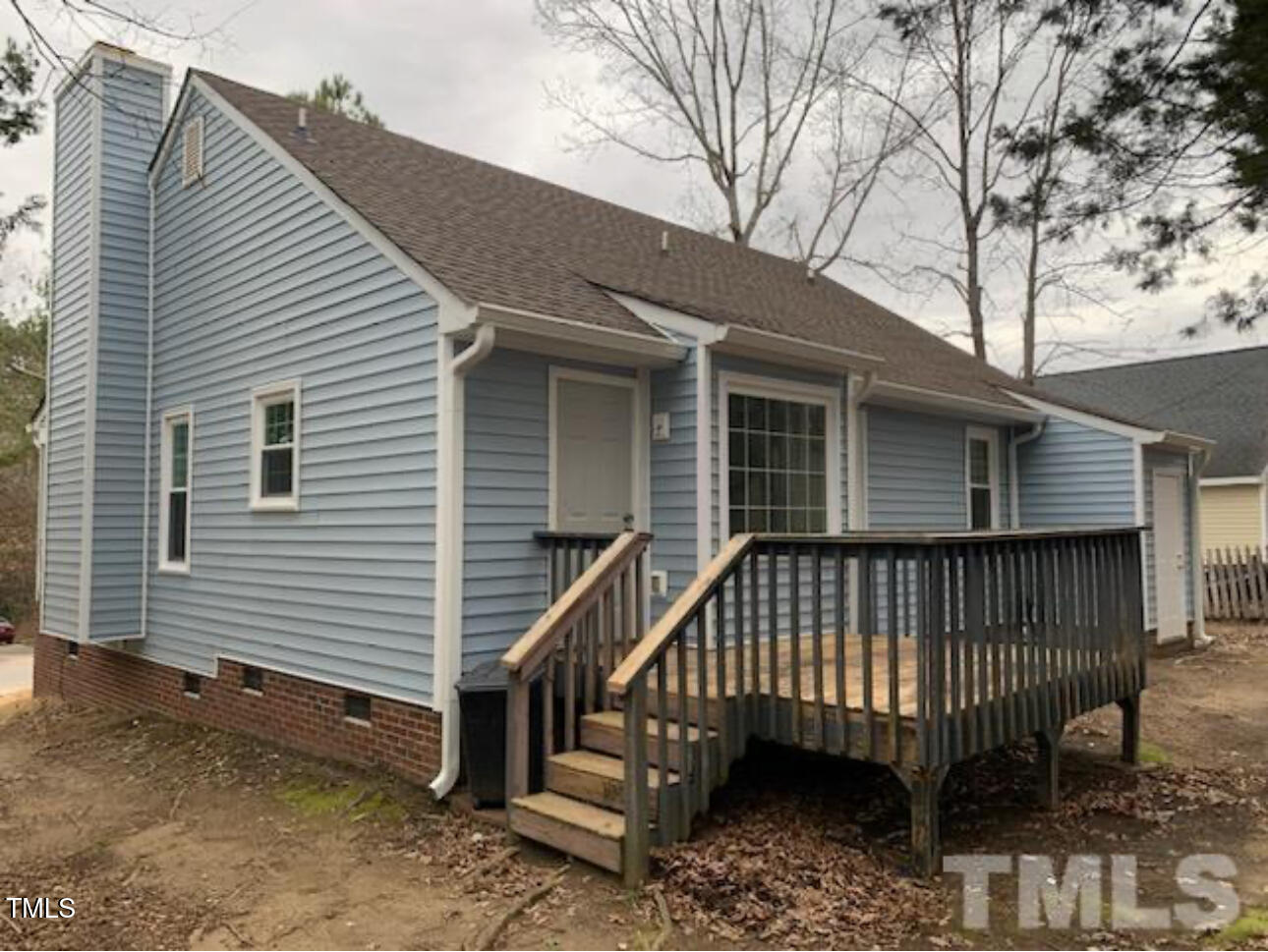 4416 Labrador Drive Raleigh, NC 27616 - Photo 19 of 19 a view of a house with a yard and deck under an umbrella