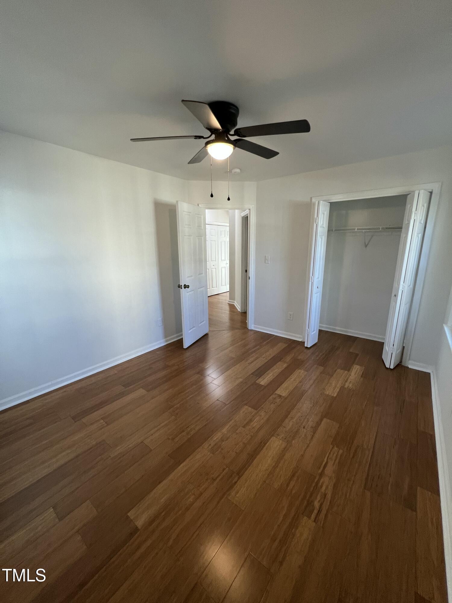 4416 Labrador Drive Raleigh, NC 27616 - Photo 8 of 19 a view of an empty room and wooden floor