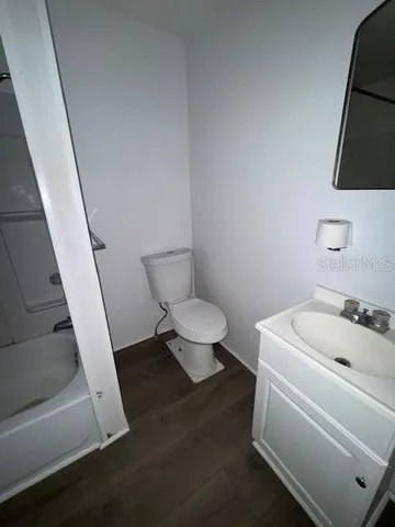a bathroom with a toilet and a sink