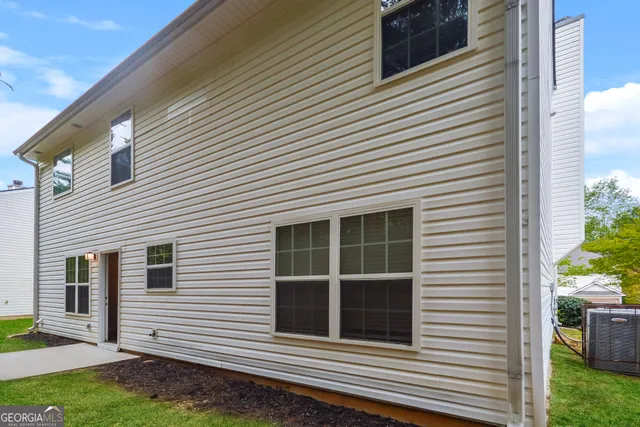 a view of a house and a yard
