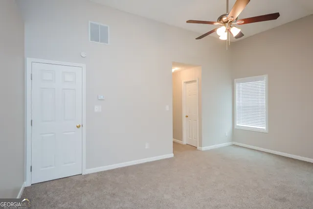 a view of an empty room with a window