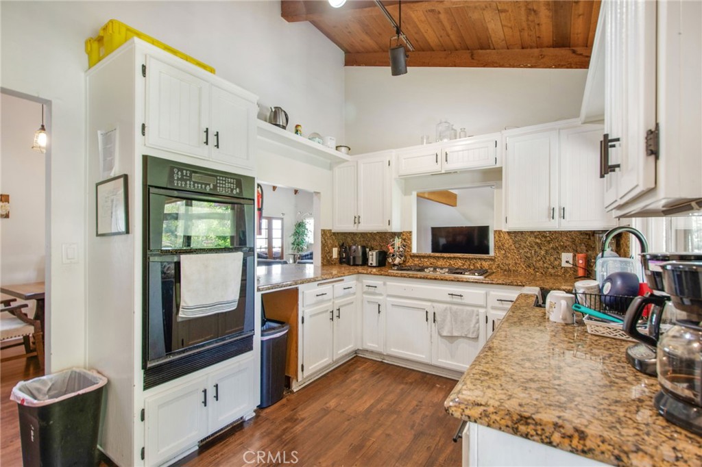 7241 Old Temescal Road Corona, CA 92881 - Photo 28 of 47 a kitchen with stainless steel appliances granite countertop a stove a sink and a refrigerator