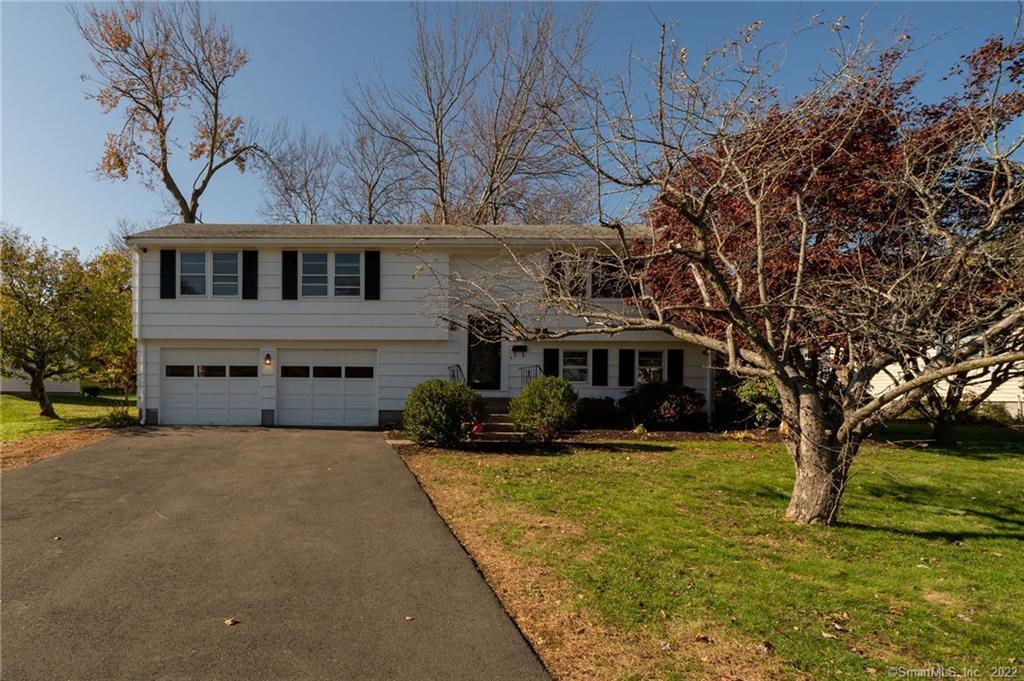 65 Ridge Crest Circle Wethersfield, CT 06109 - Photo 1 of 1 a view of a house with a yard