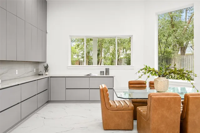 a bathroom with a granite countertop sink and vanity