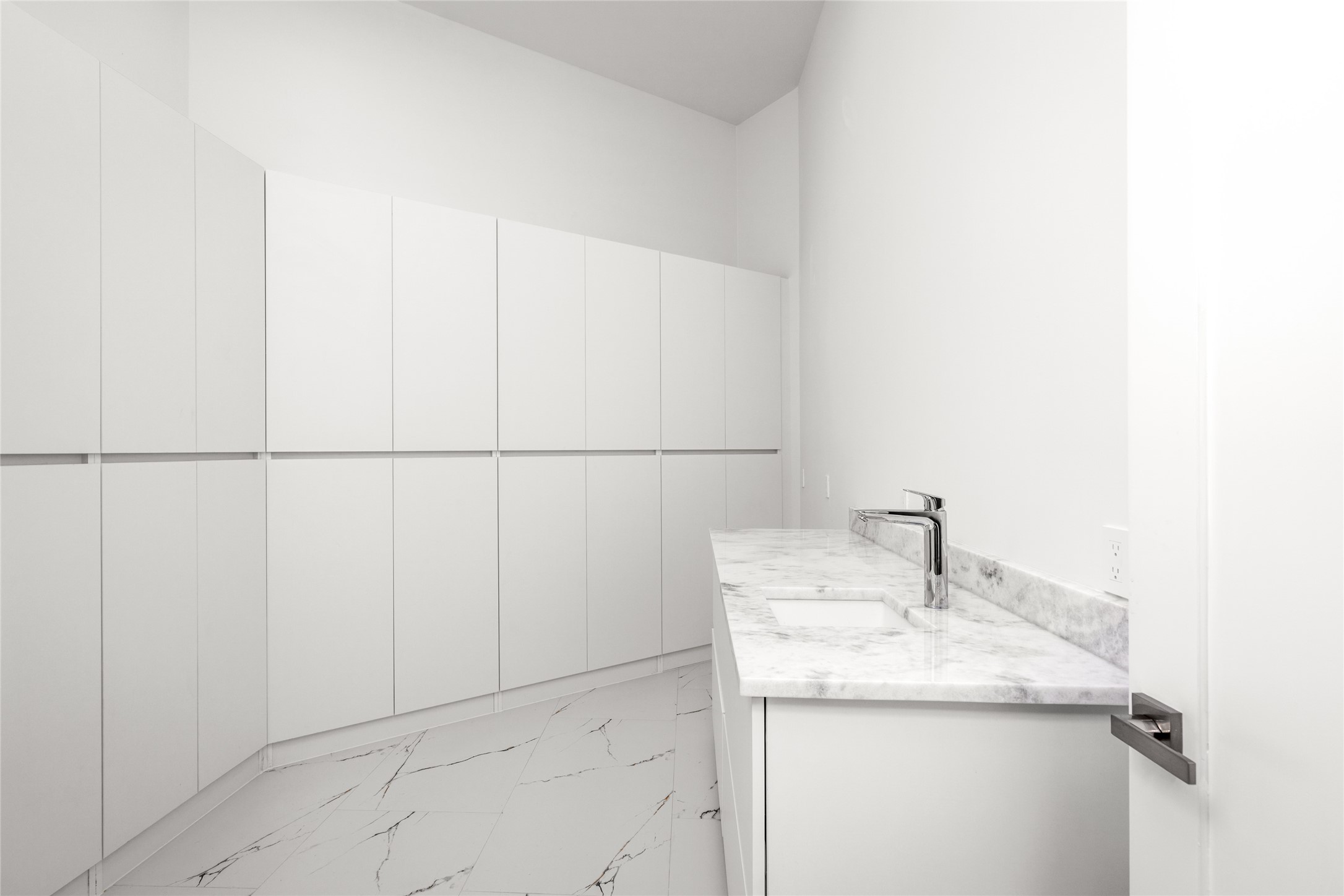 625 Piney Point Road Houston, TX 77024 - Photo 20 of 47 The oversized walk-in panty offers immense storage, plus and additional sink!