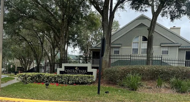 a view of a house with a yard and plants