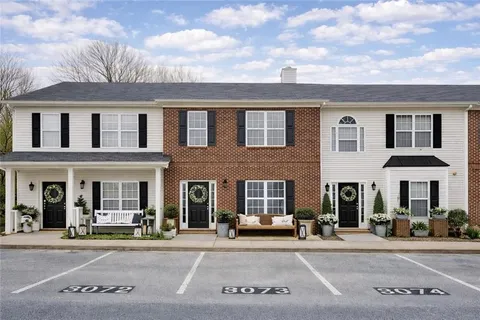 a view of a brick building with many windows