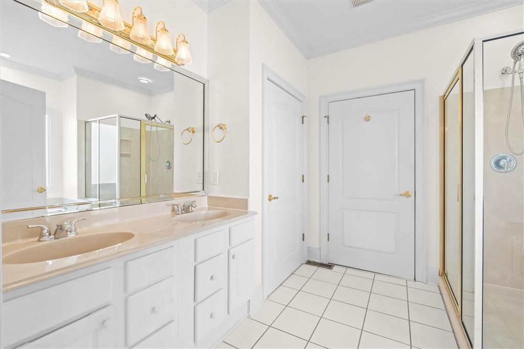 1030 Lakeview Parkway Villa Rica, GA 30180 - Photo 13 of 46 a spacious bathroom with a granite countertop sink a mirror and a