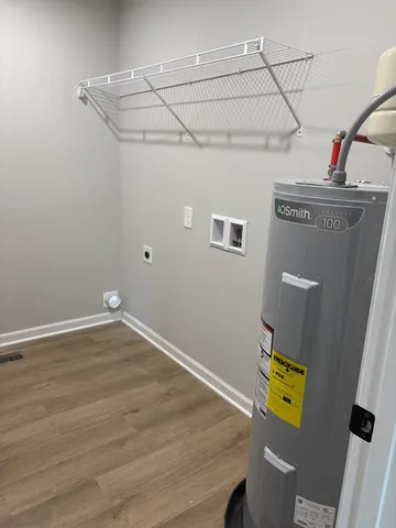 a view of storage and utility room with empty racks