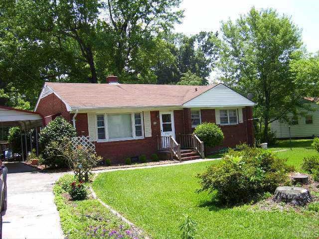 3801 Woodside Road Garner, NC 27529 - Photo 1 of 1 a front view of a house with a yard and porch