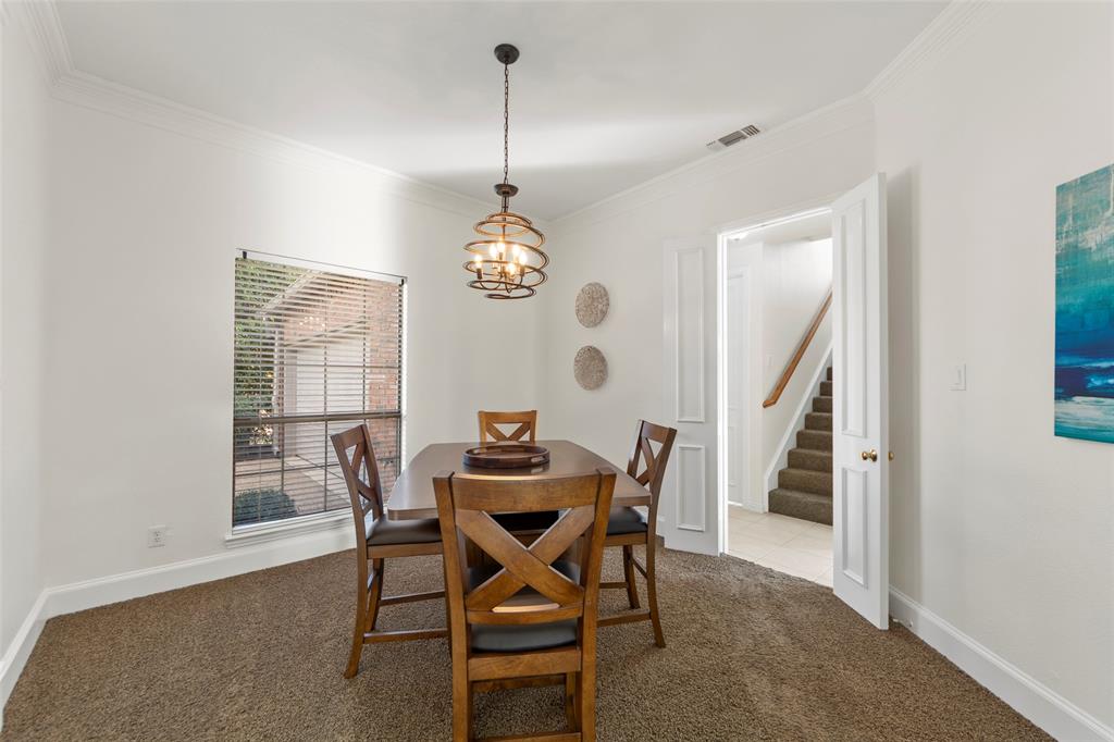 905 Sonora Drive Allen, TX 75013 - Photo 13 of 40 a view of a dining room and livingroom with furniture wooden floor a rug and a chandelier