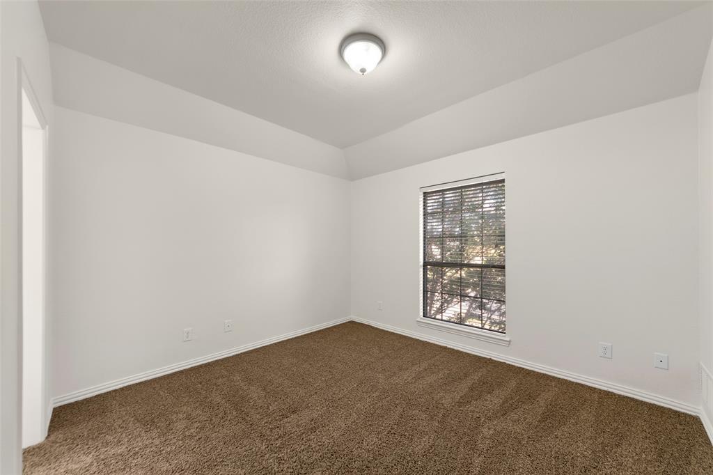 905 Sonora Drive Allen, TX 75013 - Photo 27 of 40 an empty room with windows