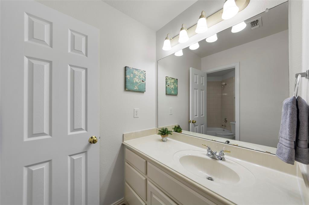 905 Sonora Drive Allen, TX 75013 - Photo 29 of 40 a bathroom with a sink vanity and a mirror