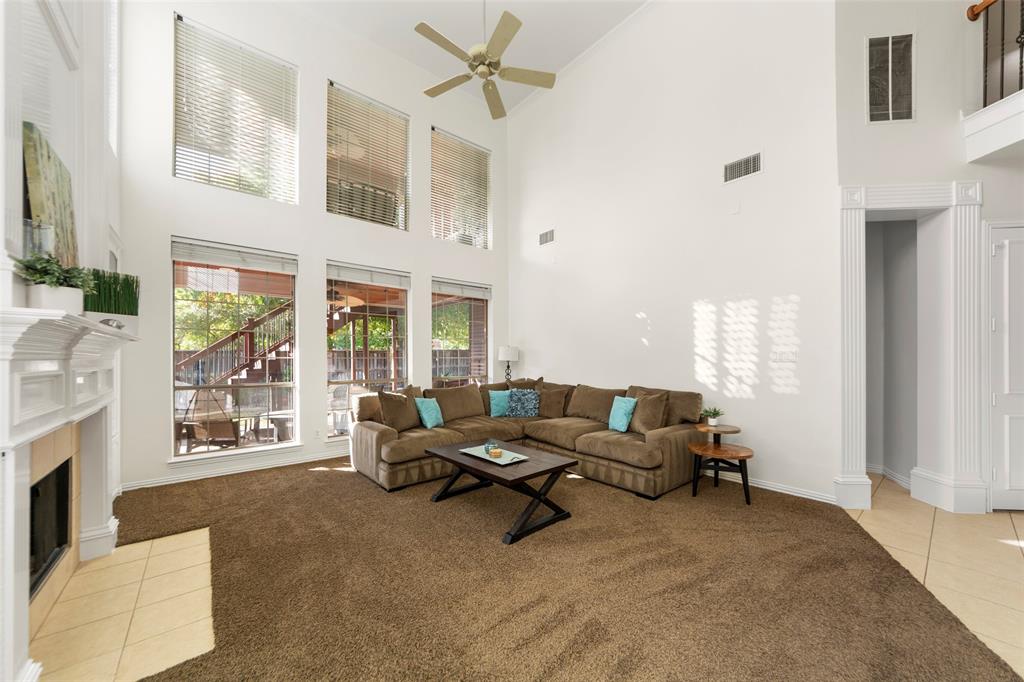 905 Sonora Drive Allen, TX 75013 - Photo 3 of 40 a living room with furniture and a fireplace