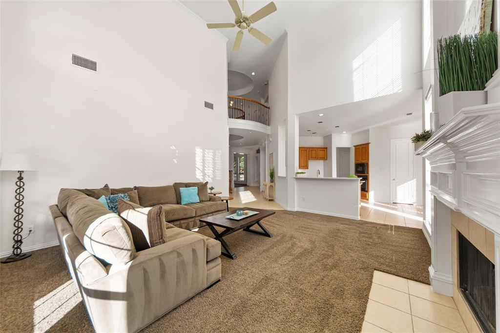 905 Sonora Drive Allen, TX 75013 - Photo 5 of 40 a living room with furniture and a fireplace