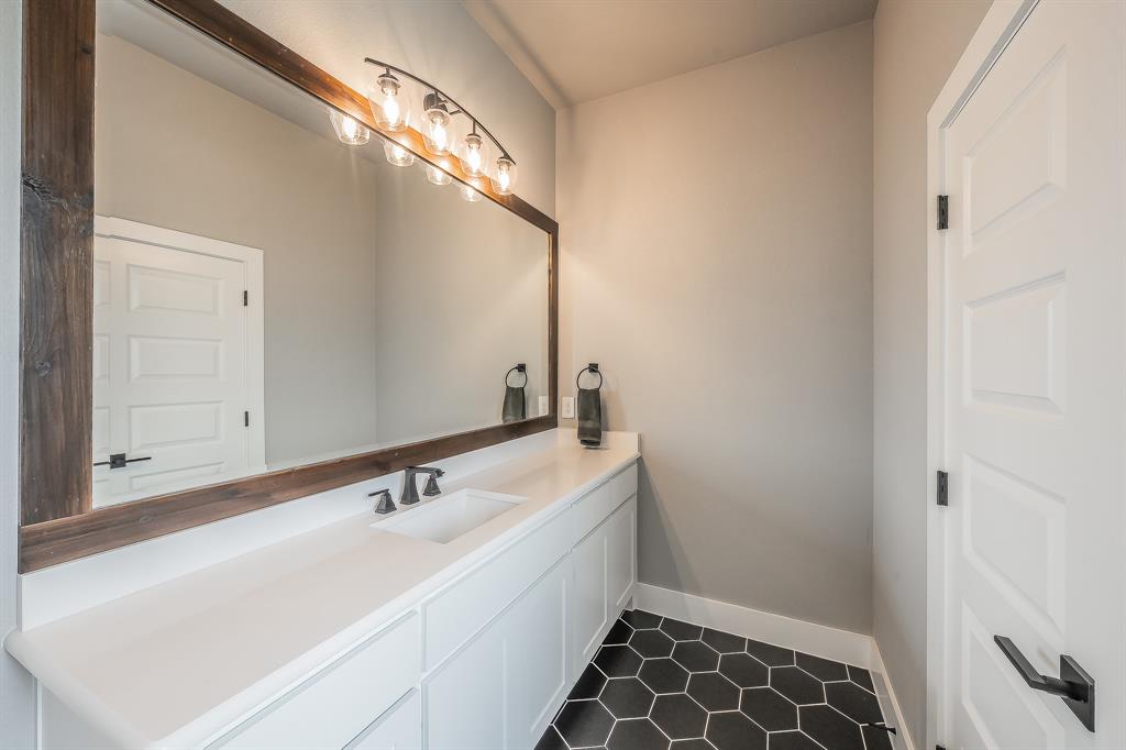 2004 Feather Lane Weatherford, TX 76088 - Photo 16 of 40 a bathroom with a sink and a mirror