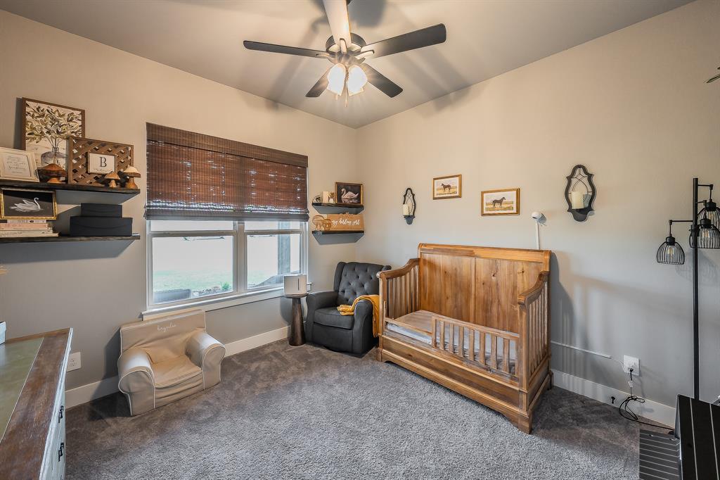 2004 Feather Lane Weatherford, TX 76088 - Photo 17 of 40 a bed room with a bed and a window