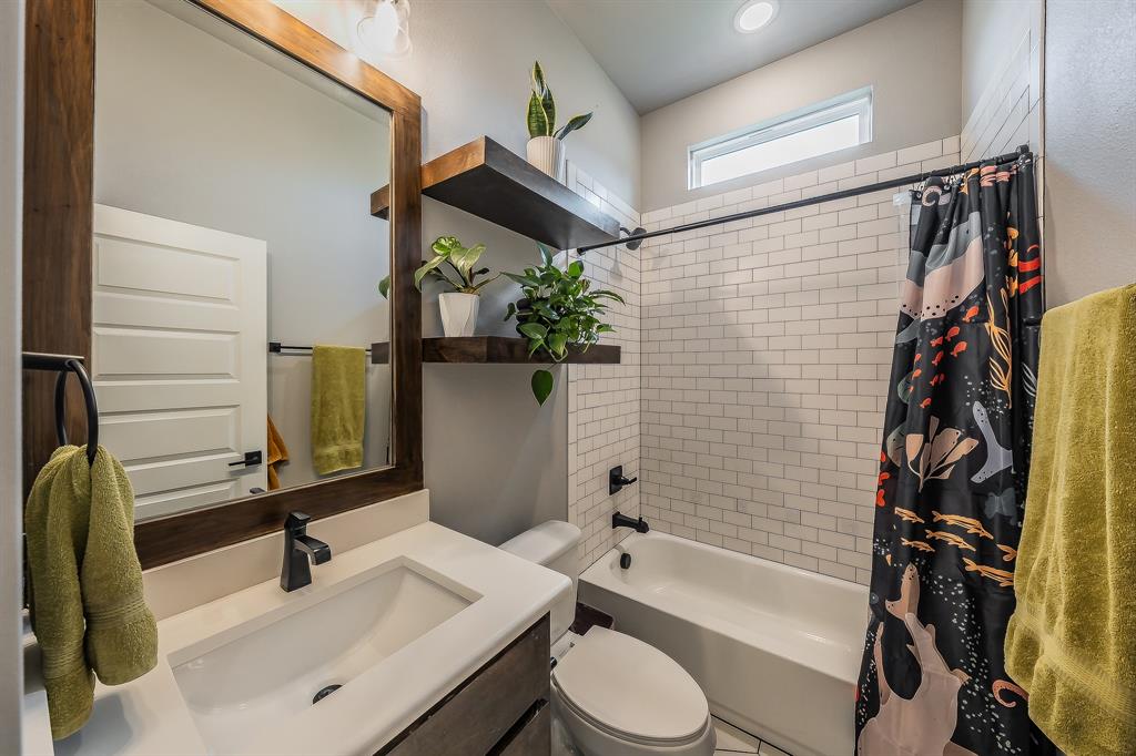 2004 Feather Lane Weatherford, TX 76088 - Photo 19 of 40 a bathroom with a sink a toilet and shower