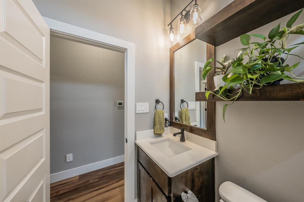 2004 Feather Lane Weatherford, TX 76088 - Photo 20 of 40 a bathroom with a sink toilet and mirror