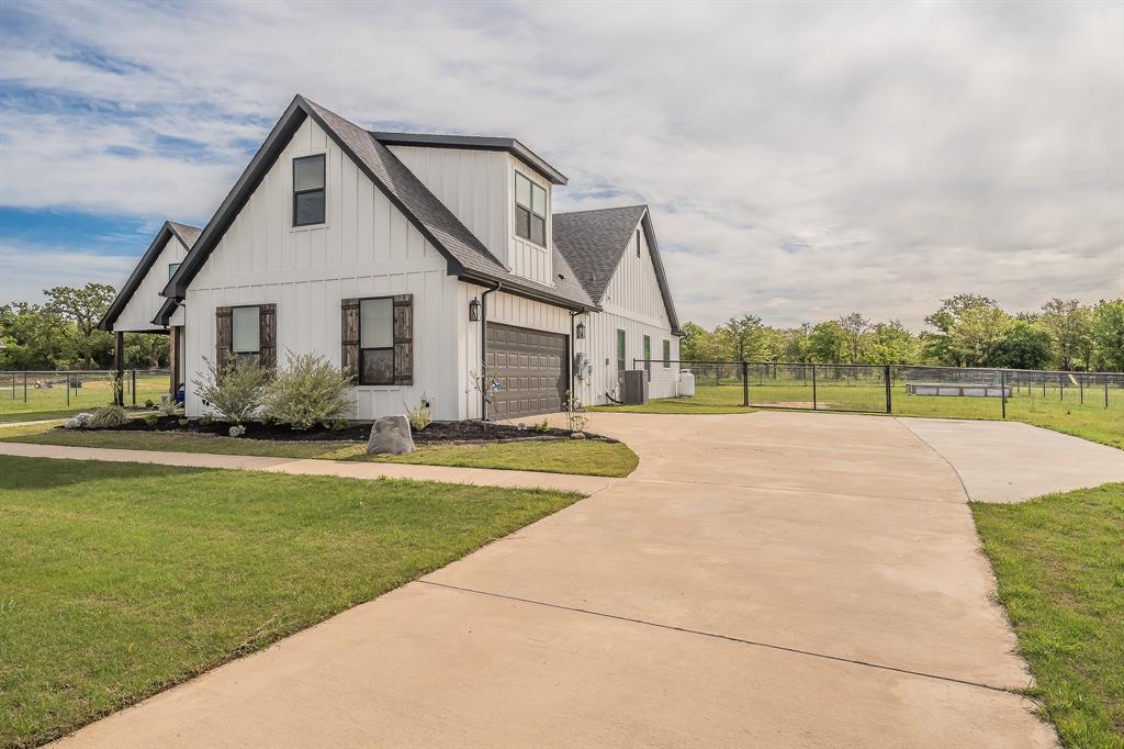 2004 Feather Lane Weatherford, TX 76088 - Photo 2 of 40 a view of a house with a yard