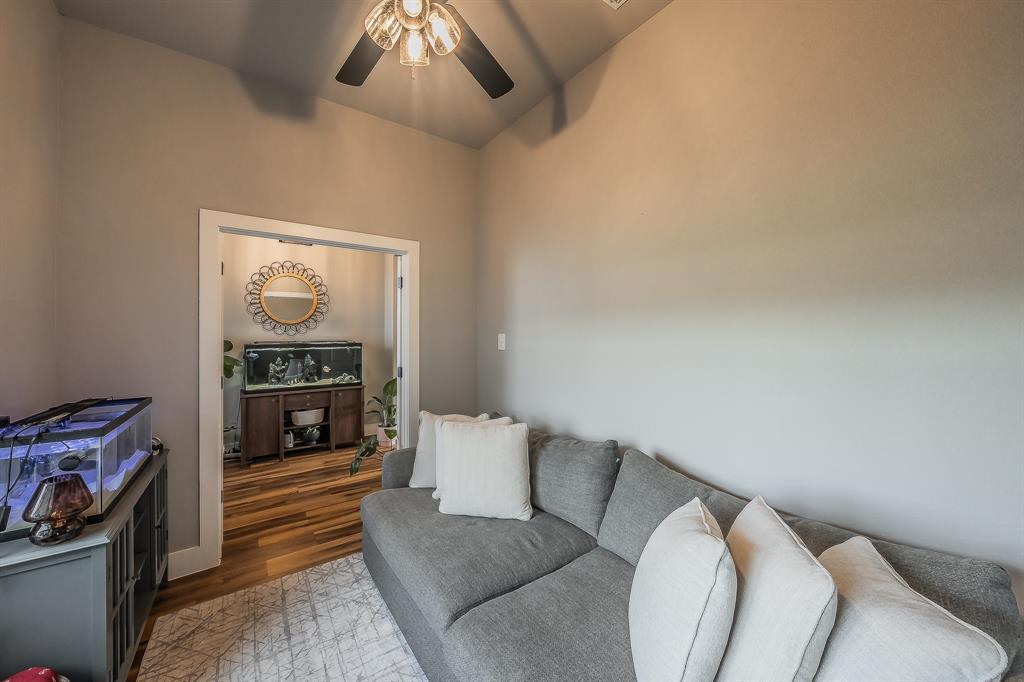2004 Feather Lane Weatherford, TX 76088 - Photo 22 of 40 a living room with furniture and a fireplace