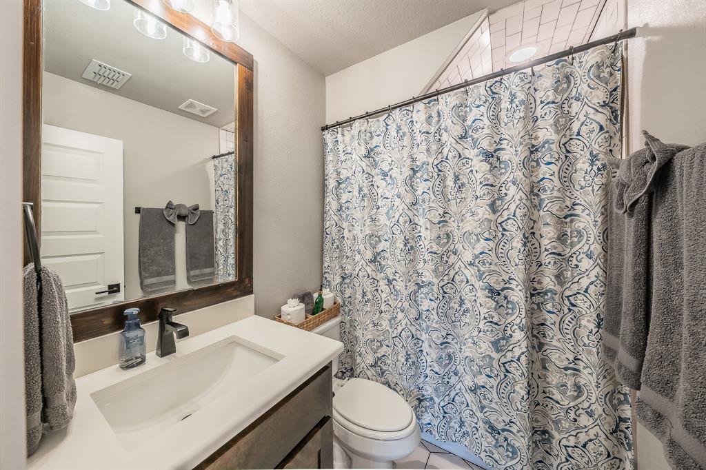 2004 Feather Lane Weatherford, TX 76088 - Photo 31 of 40 a bathroom with a sink toilet and shower