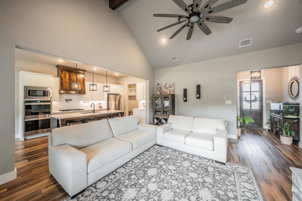 2004 Feather Lane Weatherford, TX 76088 - Photo 4 of 40 a living room with furniture and wooden floor