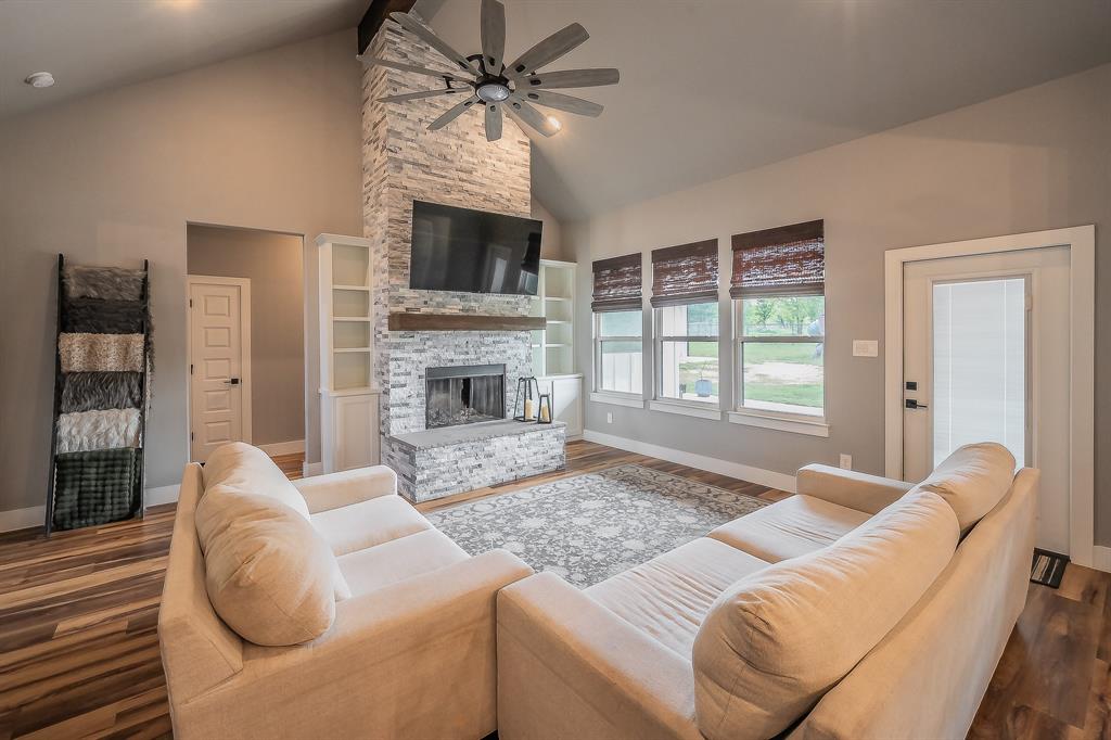 2004 Feather Lane Weatherford, TX 76088 - Photo 6 of 40 a living room with furniture fireplace and flat screen tv