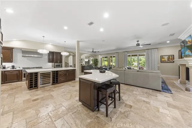 a large kitchen with cabinets table and chairs