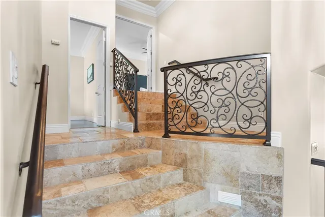 a bedroom with a large bed and a large window