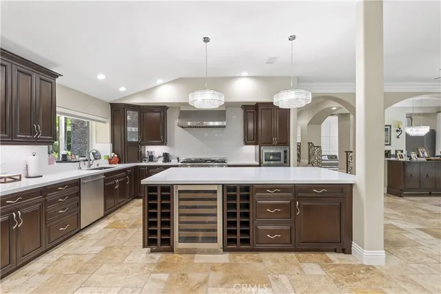 a kitchen with a table and chairs in it