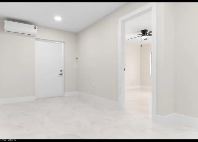 a view of kitchen with white cabinets
