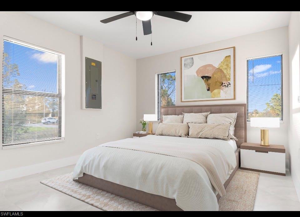 3202 8th Street Southwest Lehigh Acres, FL 33976 - Photo 17 of 21 Bedroom with electric panel, a ceiling fan, and multiple windows