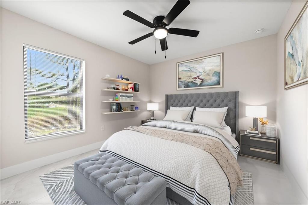 3202 8th Street Southwest Lehigh Acres, FL 33976 - Photo 6 of 21 Guest Bedroom featuring baseboards and a ceiling fan