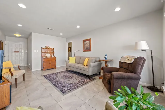 a living room with furniture and a rug