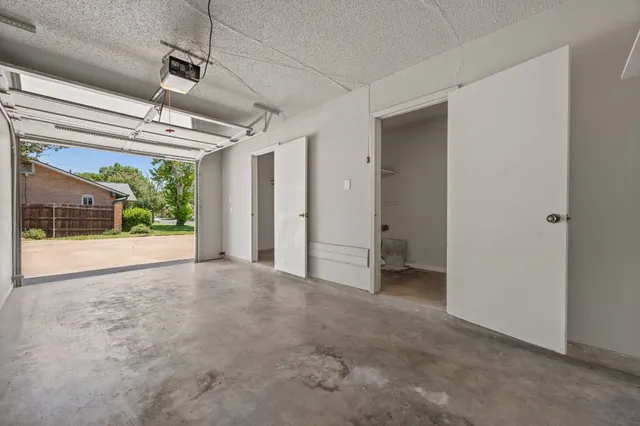 a view of a room with wooden floor and windows
