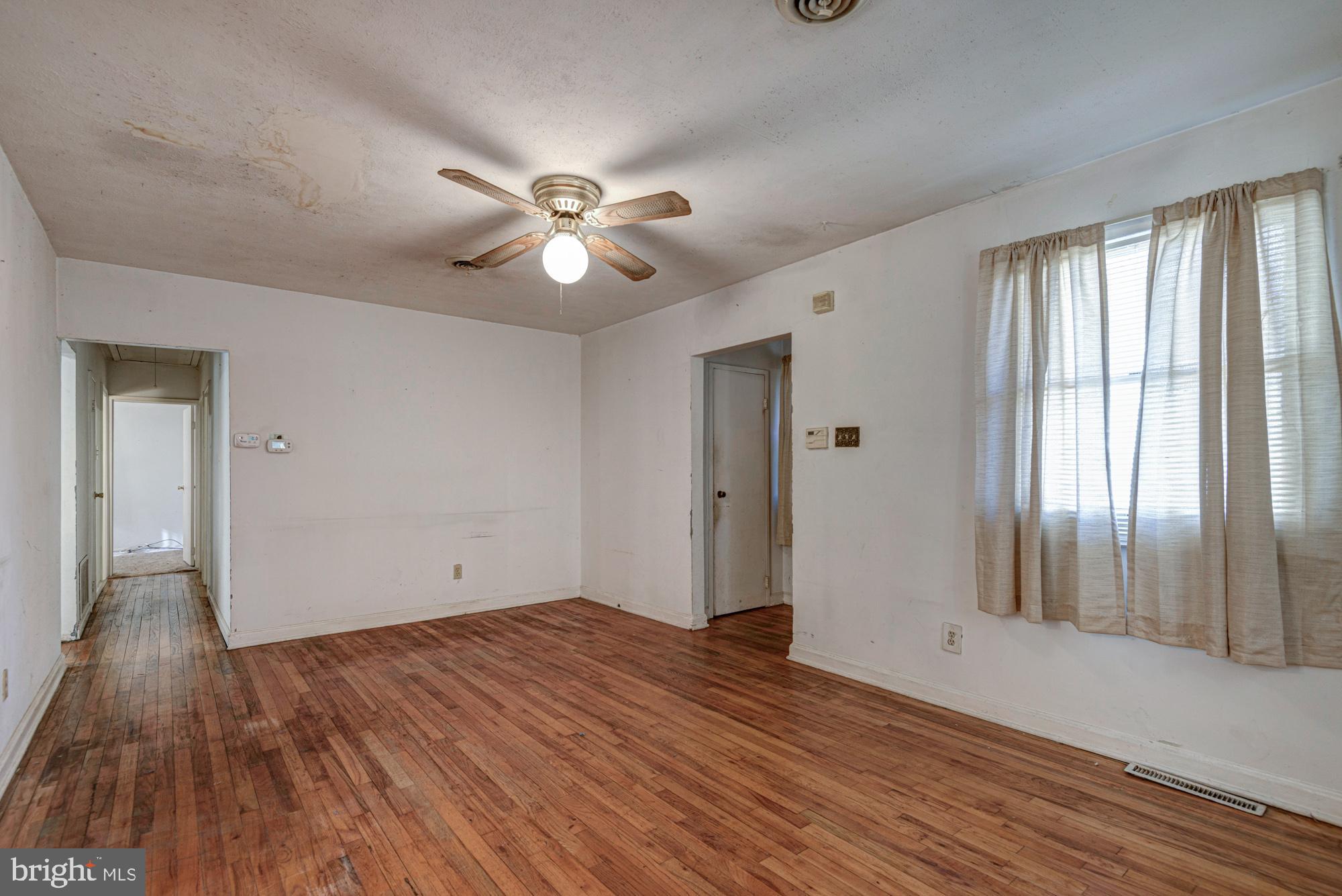 321 Bassett Avenue New Castle, DE 19720 - Photo 15 of 29 a view of empty room with wooden floor and fan