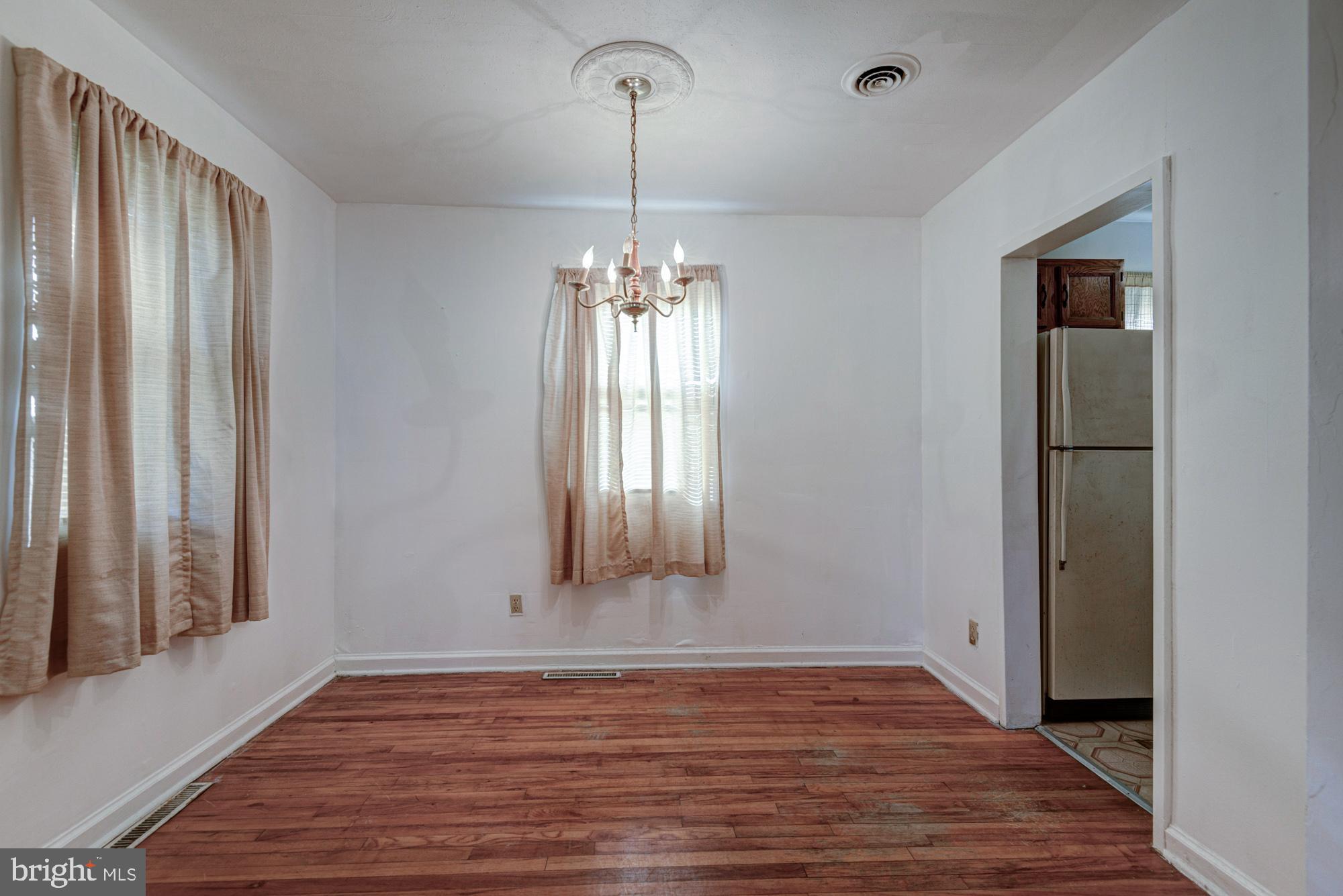 321 Bassett Avenue New Castle, DE 19720 - Photo 16 of 29 a view of a room with wooden floor and window