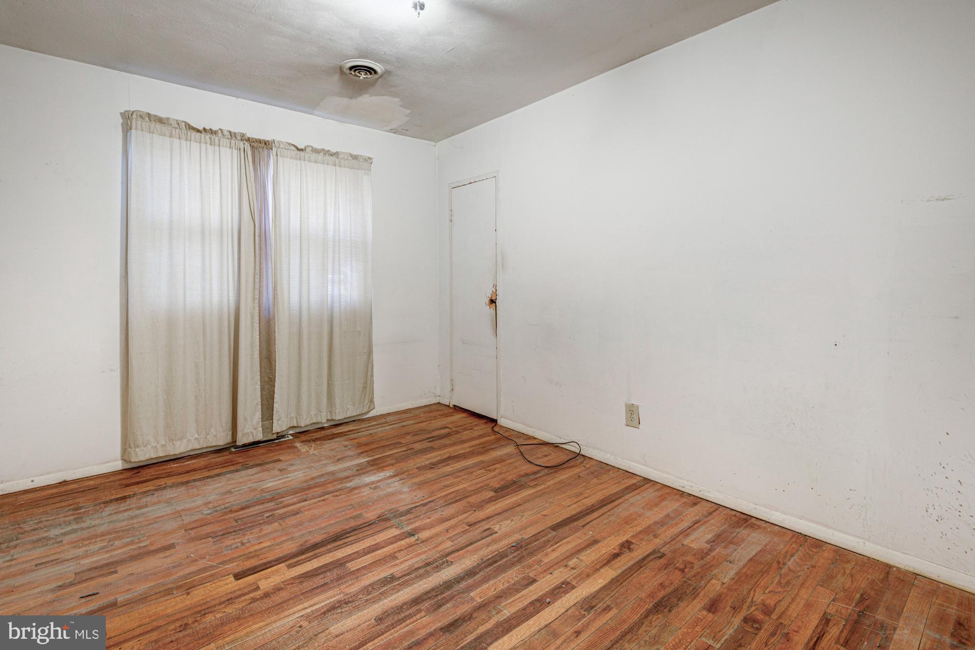 321 Bassett Avenue New Castle, DE 19720 - Photo 23 of 29 a view of an empty room with wooden floor