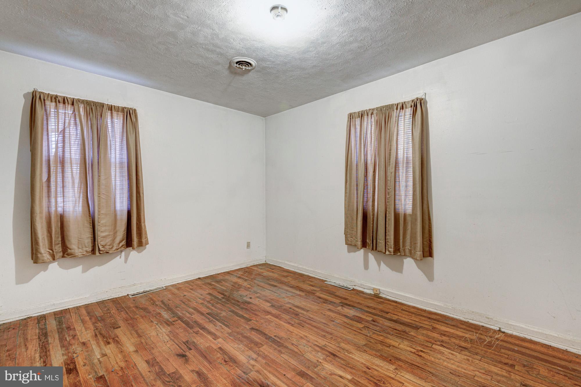 321 Bassett Avenue New Castle, DE 19720 - Photo 27 of 29 a view of a room with wooden floor and a window