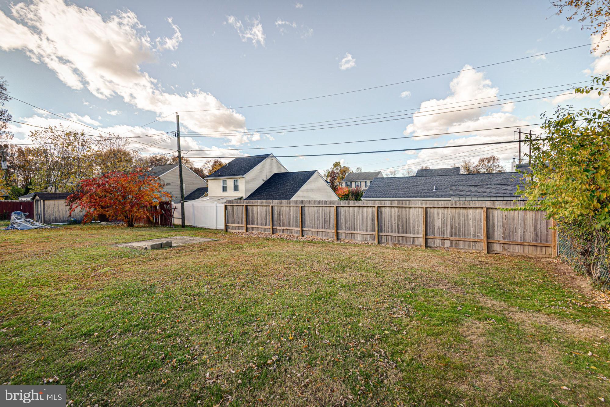 321 Bassett Avenue New Castle, DE 19720 - Photo 10 of 29 a big yard with large trees and plants