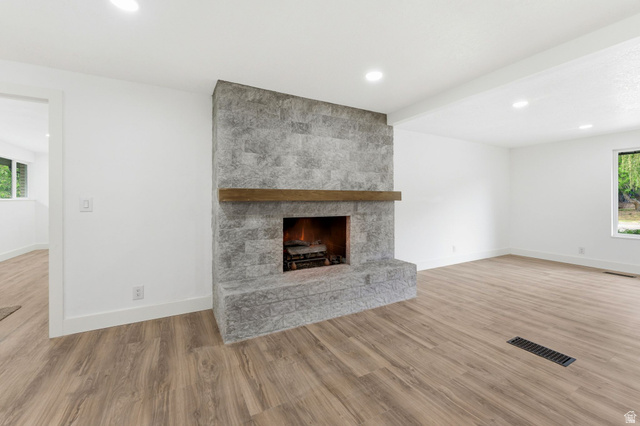 871 Bonita Way Centerville, UT 84014 - Photo 6 of 61 Stone-clad fireplace with a wood mantel