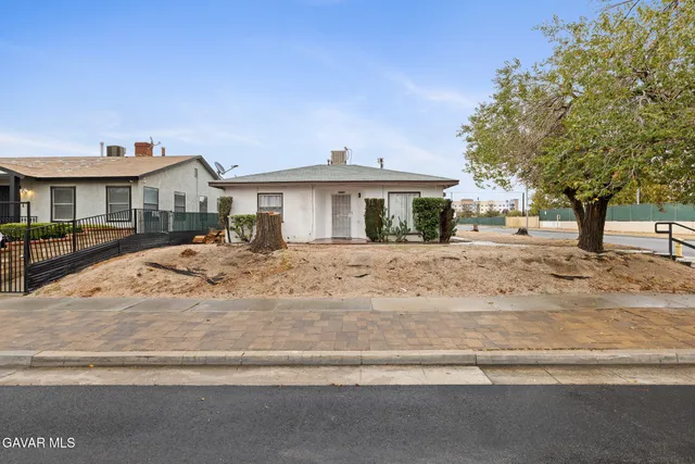 a view of a house with a snow on the road